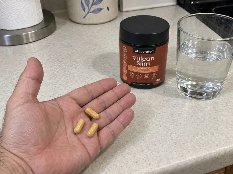 Three capsules and a glass of water.