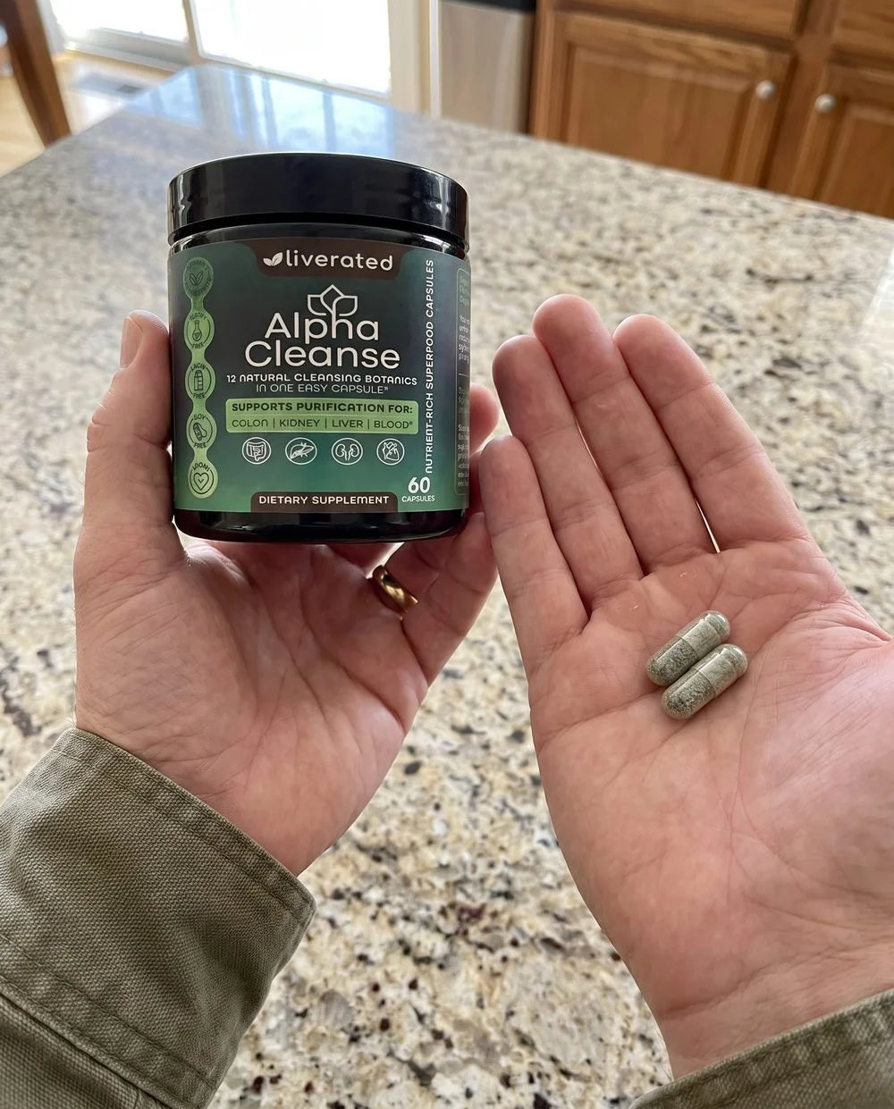 Two capsules in the palm, the jar in the other hand